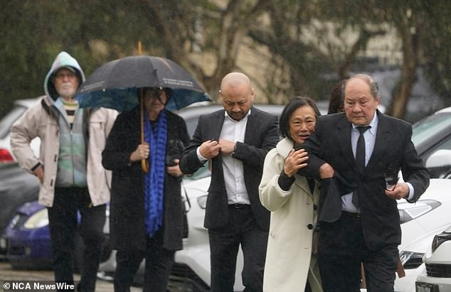 Mourners attend the memorial for Don and Gail Patterson on Thursday