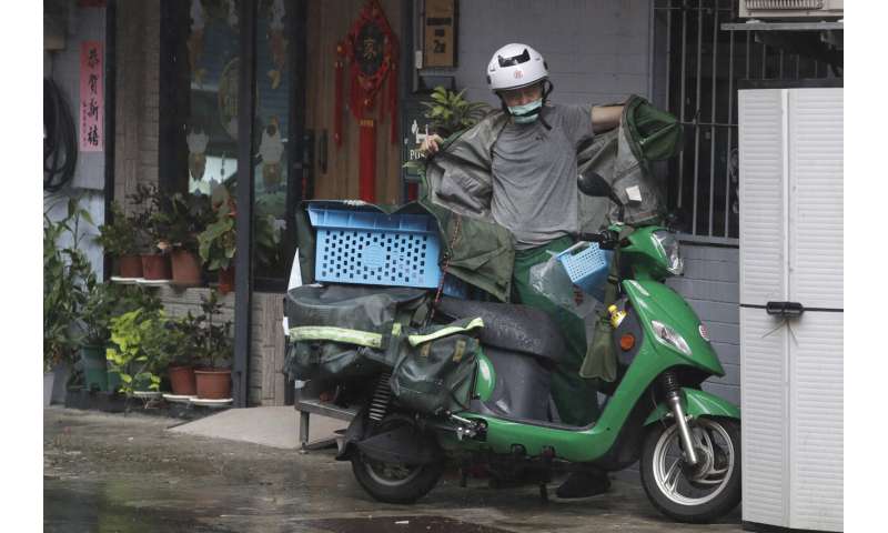 Typhoon Saola churns toward south China, suspending transport and delaying the school year