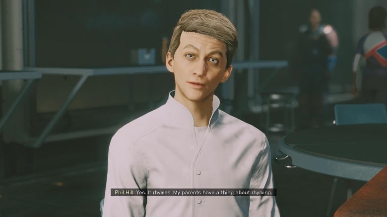 Screenshot of a video game showing a young caucasian man with a white shirt and short hair.