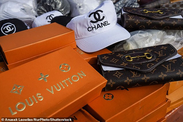 Fake luxury handbags are prepared to be destroyed during a destruction ceremony of goods that infringe intellectual property rights in Bangkok, Thailand, on August 31, 2023