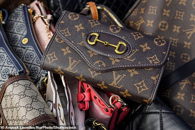 Fake luxury handbags are prepared to be destroyed during a destruction ceremony of goods that infringe intellectual property rights in Bangkok, Thailand, on August 31, 2023