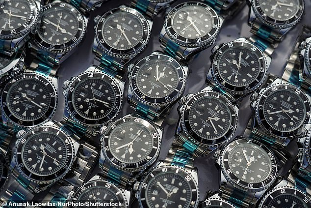 Counterfeit watches are prepared to be destroyed during a destruction ceremony of goods that infringe intellectual property rights in Bangkok, Thailand, on August 31, 2023