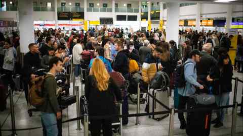 People queueing at Gatwick airport