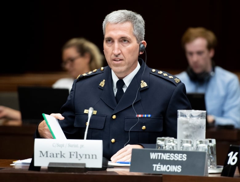 RCMP Chief Supt. Mark Flynn prepares to appear before a meeting of the Standing Committee on Public Safety and National Security on a request for a study of the Desjardins Group Data Breach, in Ottawa on Monday, July 15, 2019. 