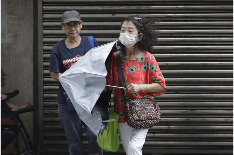 Typhoon Saola churns toward south China, suspending transport and delaying the school year