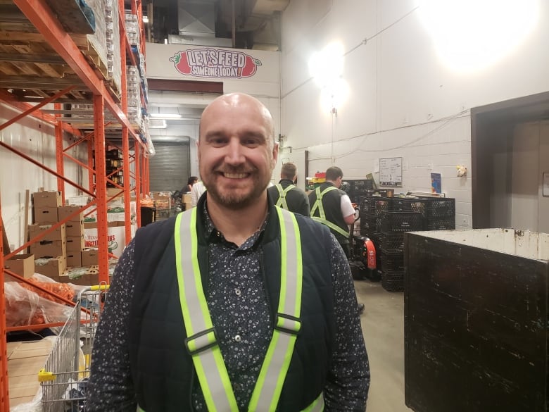 Regina Food Bank CEO John Bailey stands for a picture in the food bank's warehouse.