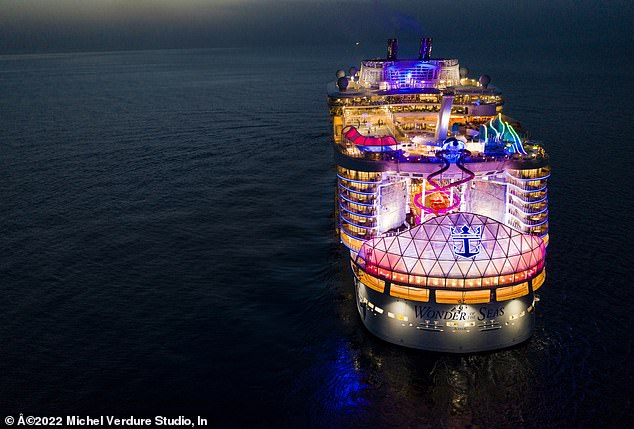 The mega-ship is 1,188 feet long and features 18 decks, and includes amenities including card room, a jogging track, laser tag, mini-golf, an outdoor movie screen, rock-climbing walls, a solarium, karaoke and a 'vitality spa