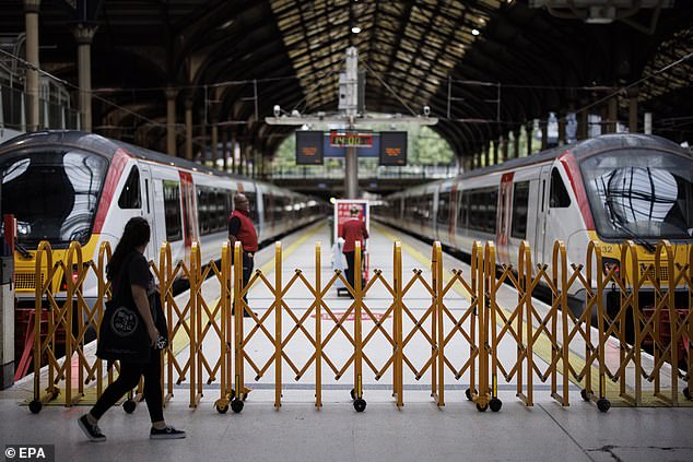 A passenger walks past a closed platform at Liverpool Street Station during a strike action by the ASLEF train drivers union on September 1