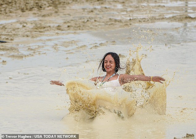 Burning Man descends into chaos as one person DIES at flooded festival after officials closed gates, ‘trapping’ 73,000 revelers in hypothermic conditions – and told them to conserve water and food