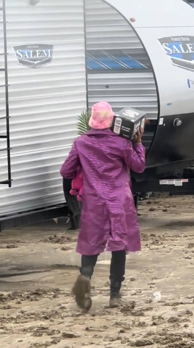 With attendees forced to shelter in place, one person could be seen carrying a case of beer