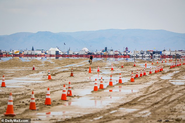 Cones line the muddy routes towards the festival although the gates have now been shuttered