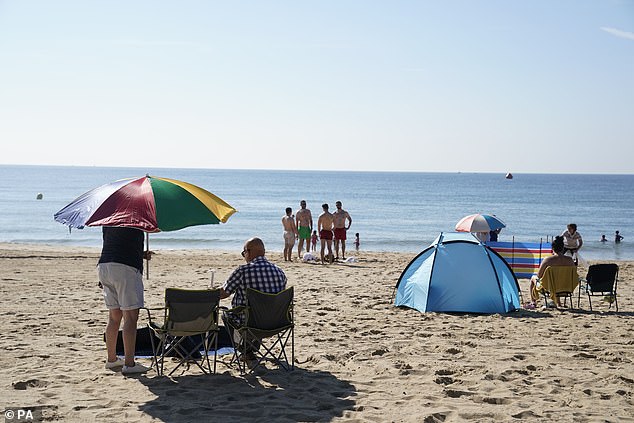 People made the best of the warm temperatures at the beach in Bournemouth today