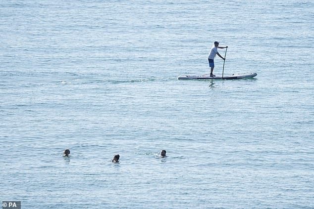 Some went to cool themselves down in the water in Bournemouth this morning as temperatures rise