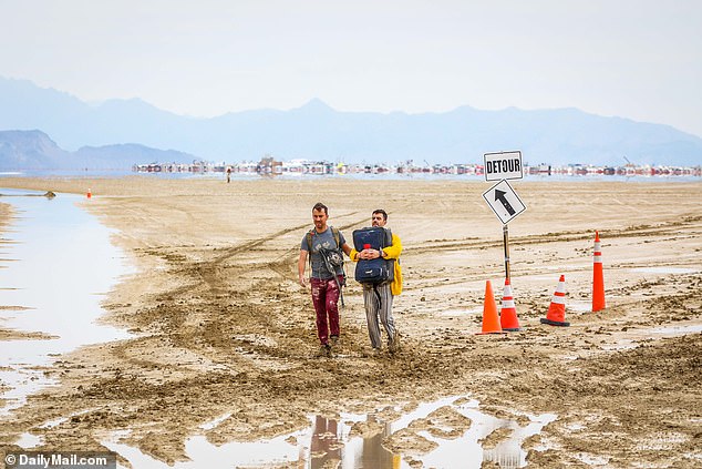 Burning Man attendees try to leave the festival in the Black Rock Desert in Nevada