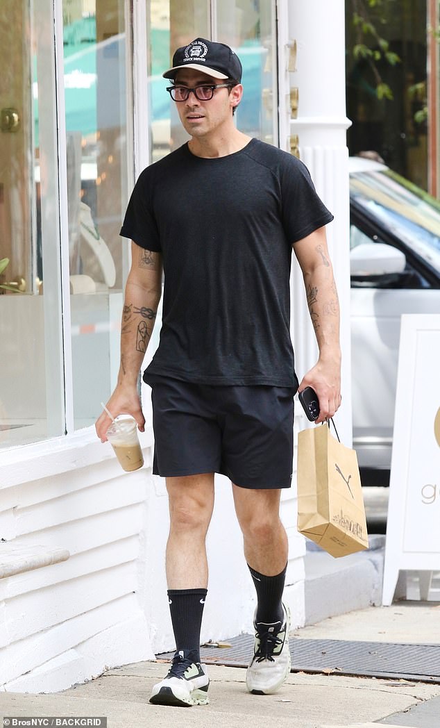 Bad omen: Joe Jonas was seen without his wedding ring in NYC on August 11 (pictured), ahead of TMZ's report that he has contacted two attorneys before divorcing his wife Sophie Turner, 27