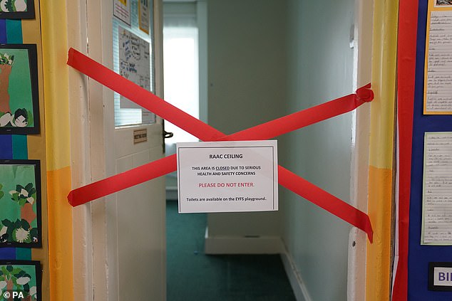 The Welsh government is expected to give an update on the presence of the concrete today. Pictured: A taped off section inside Parks Primary School in Leicester which has been affected with sub standard reinforced autoclaved aerated concrete