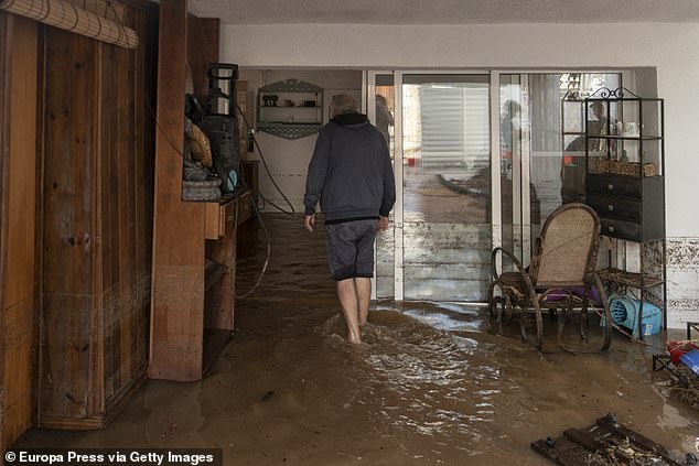 A man in his house flooded by the rains, on September 3, 2023, in Les Cases d'Alcanar, Tarragona, Catalonia, Spain