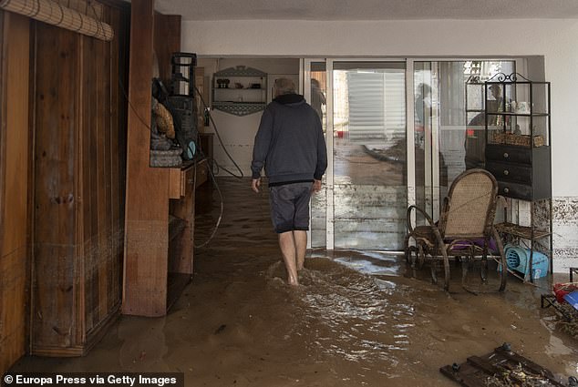 A man in his house flooded by the rains, on September 3, 2023, in Les Cases d'Alcanar, Tarragona, Catalonia, Spain