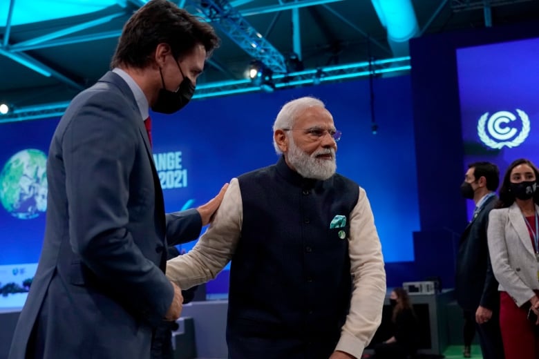 India Prime Minister Narendra Modi, right, speaks with Canada's Prime Minister Justin Trudeau as they attend the opening ceremony of the COP26 U.N. Climate Summit, in Glasgow, Scotland, Monday, Nov. 1, 2021.