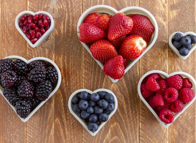 bowls of berries and pomegranate seeds