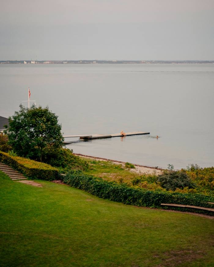 View of the sea, looking down a grassy slope, from The Louisiana