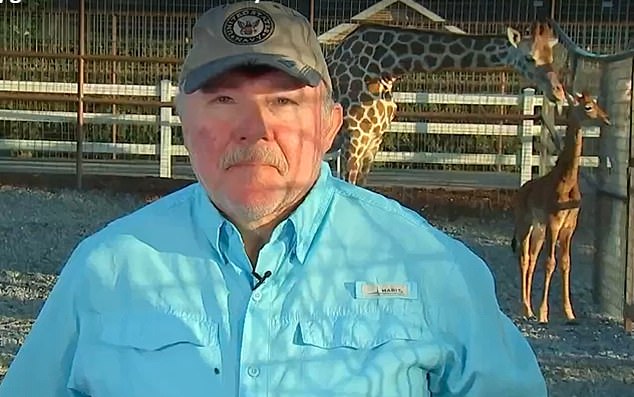 Director David Bright with his new arrival and her mother at the zoo in Tennessee