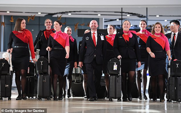 The abrupt departure of Qantas boss Alan Joyce has sparked jubilant celebrations from Qantas staff (stock photo of Qantas crew)