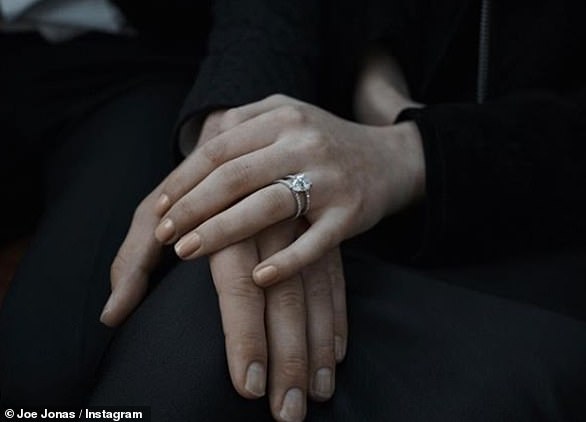 Engaged! The couple shared a picture of Sophie's diamond spoiler after Joe proposed