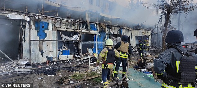 Firefighters work at the site of a Russian military strike, amid Russia's attack on Ukraine