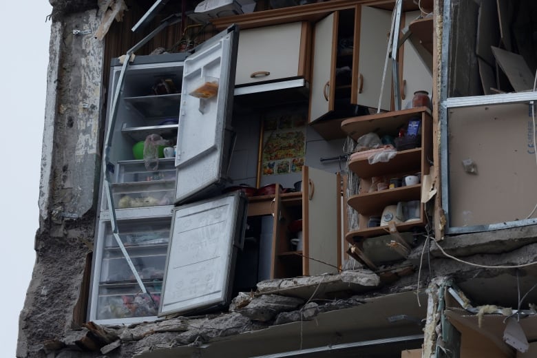 The insides of an apartment are exposed after being hit with a missile