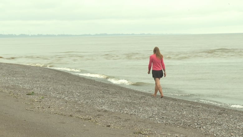 Picture of Kim walking down the beach 