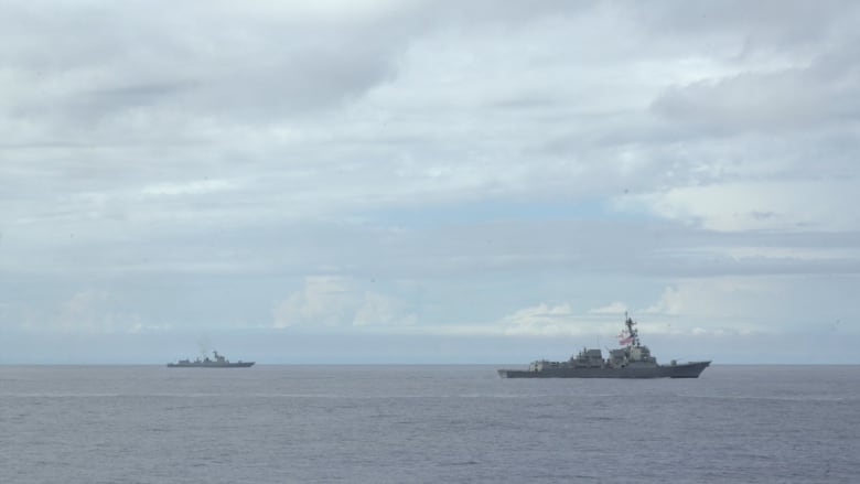 China’s Luyang destroyer gives way to the USS Ralph Johnson, a US Navy vessel, as it pulls away from an anti-submarine exercise with allies.