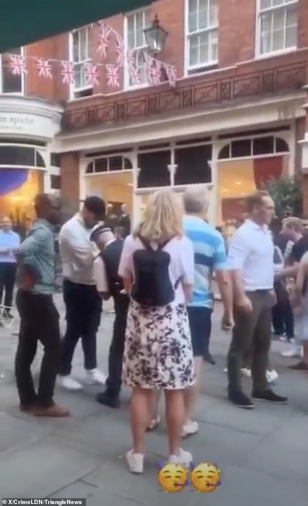 Union Jack flags can be seen festooned above the scene in Sloane Square yesterday