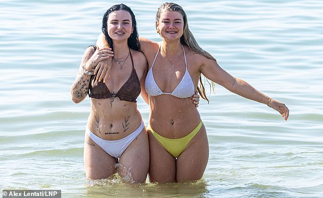 Swimmers at Brighton beach were pictured taking a dip in the cooling waters of the sea