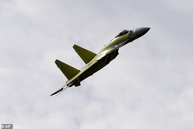 Pictured: A Russian SU-35 fighter makes a demonstration flight in the far eastern region of Khabarovsky Krai on September 15