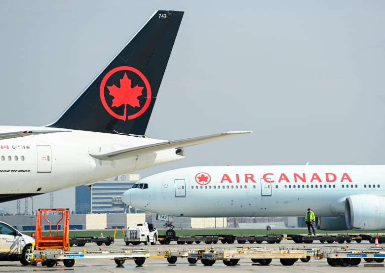 Planes on the tarmac at an airport.