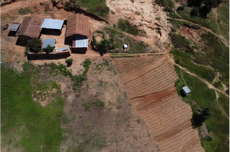 Residents are learning to build ditches above their sloped fields of corn or beans, so that water trickles down through the plants and keeps the soil moist for longer