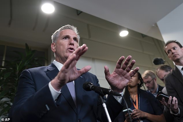 Speaker of the House Kevin McCarthy talks to reporters following a closed-door meeting with House Republicans after his last-ditch plan to keep the government temporarily open collapsed