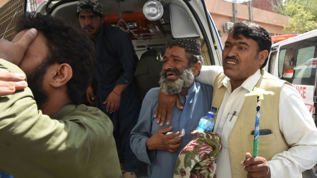 Pakistan bombings kill dozens, trap others under rubble