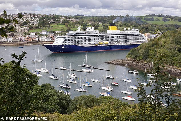 ‘Awful – shouldn’t be allowed!’: Angry locals of tiny Cornish town that banned second homes blast arrival of huge cruise ship that increases the local population by 50 per cent