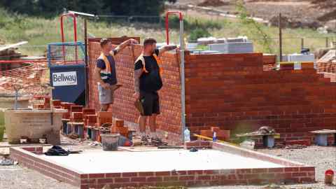 Bricklayers at a housing development in England in August 2023