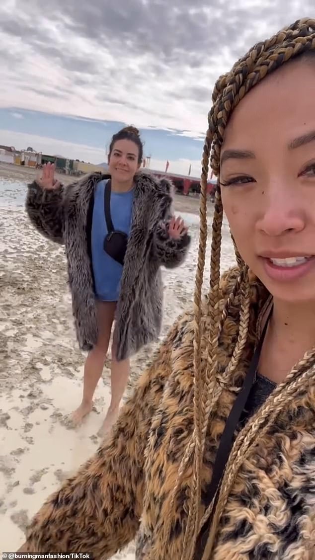 Burning Man revelers walk around swamped Nevada desert BAREFOOT with just tins of tuna to eat – as 73,000 are stranded and one person dies