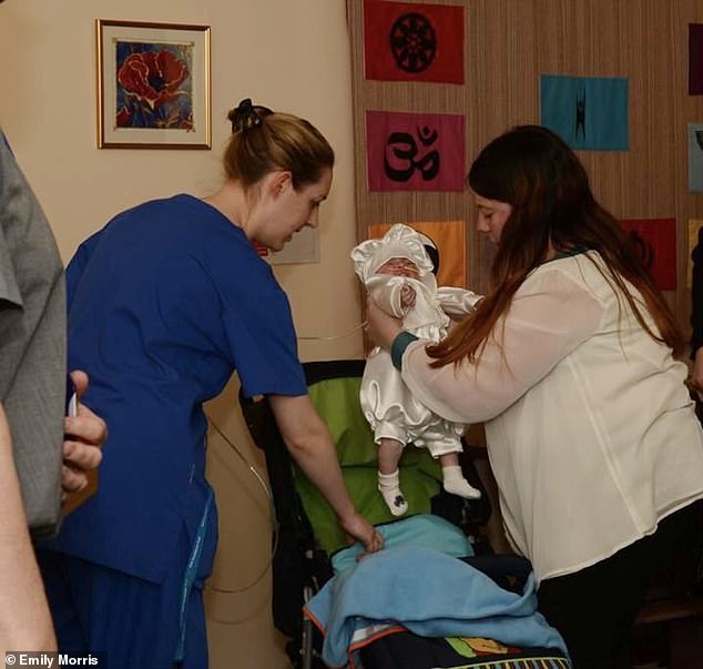 Chilling image shows Lucy Letby at the christening of a newborn baby who died on the unit where nurse carried out her killing spree – as mother calls for her son’s case to be reopened