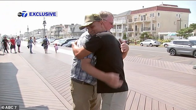 Dramatic moment marine veteran Stephen Houser saves swimmer caught in rip tide at Sea Bright beach in New Jersey – as three die in rough waves over the weekend