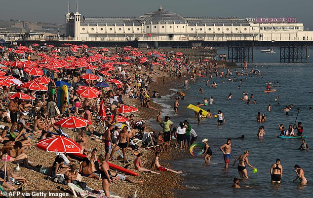 Fire up the BBQ! Britons look set to enjoy sizzling Saturday when heatwave will peak at 33C (91.4F) with trips to beaches, sold-out lidos and waterparks as demand for sausages, burgers, Pimms and ice creams soars