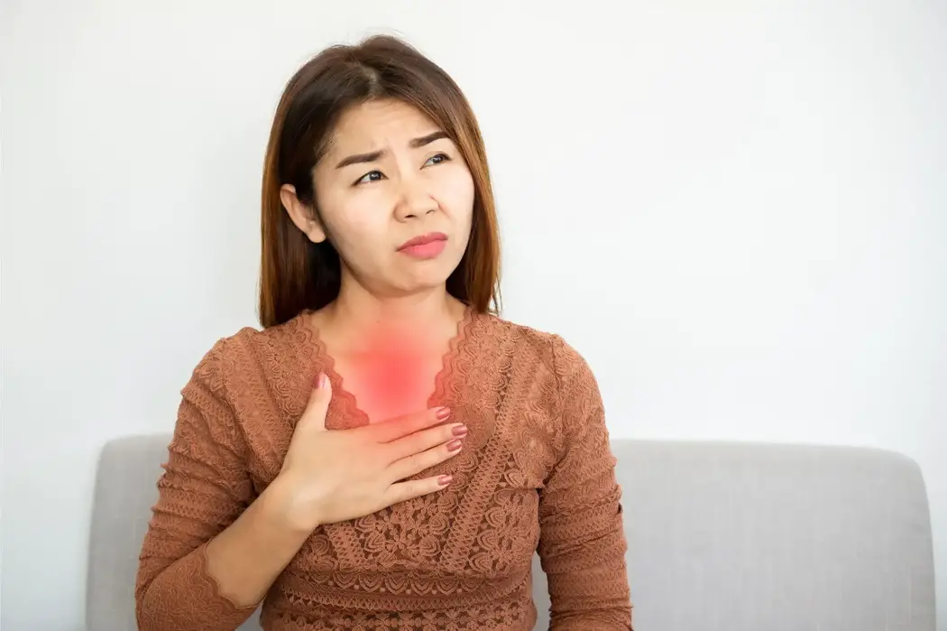 Asian Woman Heartburn