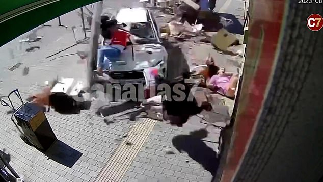 Horrifying moment British tourist’s hire car smashes into cafe terrace in Fuerteventura, injuring eight people, including a four-month-old baby