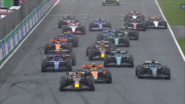 Sergio Perez takes advantage of an early first lap pitstop to take the lead in a rain affected Dutch GP