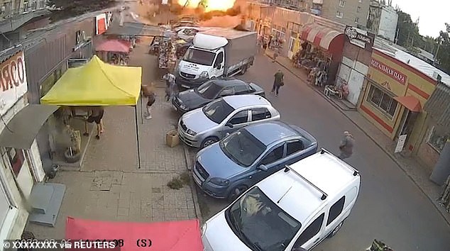 Massacre at the market: Moment Russian artillery obliterates shops, killing at least 16 people and wounding 28 in Ukraine