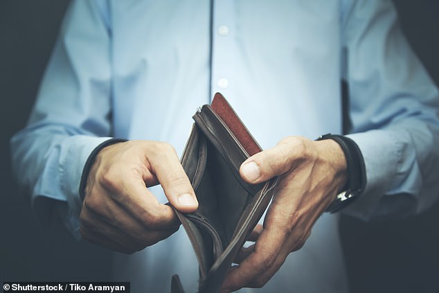 Millions of people spend more money than they have in their bank accounts at least seven months a year as dire report warns nearly 20% of people have nothing left or a negative bank balance before payday